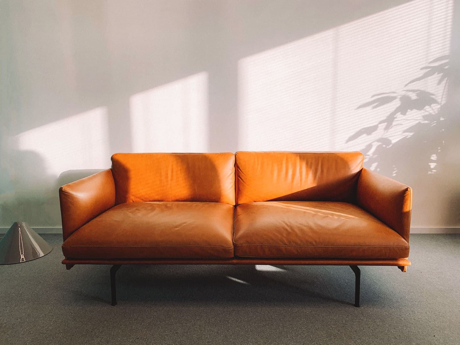 A leather sofa in an empty room